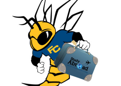 Buzzy mascot with suitcase